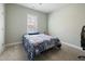Bedroom with neutral walls, window, carpet, and closet offers comfort and style at 169 Black Cloud Dr, Louisburg, NC 27549