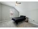 Bedroom with a sloped ceiling, neutral walls, and a cozy vibe at 169 Black Cloud Dr, Louisburg, NC 27549