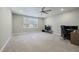 Spacious bonus room features a window, ceiling fan, carpet, and desk area at 169 Black Cloud Dr, Louisburg, NC 27549