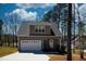 Charming home with a one-car garage and a inviting entrance on a large lot at 169 Black Cloud Dr, Louisburg, NC 27549