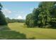 Picturesque view of the golf course, providing a serene and relaxing backdrop at 169 Black Cloud Dr, Louisburg, NC 27549