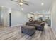 Spacious living room open to the kitchen, hardwood flooring, and comfortable seating at 169 Black Cloud Dr, Louisburg, NC 27549
