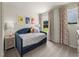 Charming bedroom featuring unique artwork, plush carpeting, and ample natural light at 18 Thistle Patch Pl, Angier, NC 27501