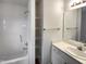 Bathroom features a tub/shower combo and vanity with storage and a big mirror at 2013 Turtle Point Dr, Raleigh, NC 27604