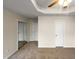Bedroom features carpet, sliding mirror door closet, ceiling fan and doors at 2013 Turtle Point Dr, Raleigh, NC 27604