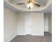 View of a bedroom featuring neutral paint, carpet, ceiling fan and doors at 2013 Turtle Point Dr, Raleigh, NC 27604