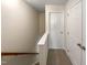 Upstairs hallway featuring doors and railing at 2013 Turtle Point Dr, Raleigh, NC 27604