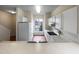 Kitchen with white cabinets, appliances, and a sink under a bright window at 2013 Turtle Point Dr, Raleigh, NC 27604
