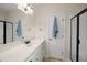 Modern bathroom with a white vanity, black fixtures, and a framed mirror at 21 Tracker Ct, Garner, NC 27529