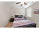 Cozy bedroom with a comfortable bed, ceiling fan, and natural light at 21 Tracker Ct, Garner, NC 27529