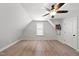Charming bedroom featuring hardwood floors, natural light, and a modern ceiling fan at 21 Tracker Ct, Garner, NC 27529