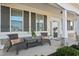 Charming front porch seating area with rocking chairs and decorative pillows, perfect for relaxing outdoors at 21 Tracker Ct, Garner, NC 27529