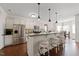 Kitchen with stainless steel appliances and barstool seating overlooking the breakfast nook at 21 Tracker Ct, Garner, NC 27529