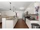 Kitchen with granite countertops, stainless steel appliances, tile backsplash and hardwood floors at 21 Tracker Ct, Garner, NC 27529