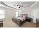 Bedroom with trey ceilings, neutral decor, and a ceiling fan at 21 Tracker Ct, Garner, NC 27529