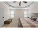 Bedroom with neutral colored carpet and walls, trey ceilings and natural light at 21 Tracker Ct, Garner, NC 27529