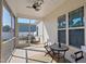 Covered screened porch with outdoor seating and a ceiling fan at 21 Tracker Ct, Garner, NC 27529