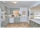 Charming kitchen features gray cabinets, modern appliances, and plenty of natural light at 2208 Tampa Ave, Durham, NC 27705