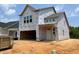 Exterior of home under construction featuring large windows and attached garage at 239 Meadowbark Bnd # 27, Garner, NC 27529