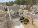 Bird's eye view of a two-story home with a two-car garage, a driveway and landscaped surroundings at 241 Westgrove Ct, Durham, NC 27703