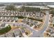 An aerial view shows a neighborhood with well-maintained lawns and paved streets at 241 Westgrove Ct, Durham, NC 27703