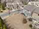 An aerial view shows the house and large back yard and surrounding neighborhood at 241 Westgrove Ct, Durham, NC 27703
