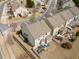 Aerial view of backyards with patio seating, fencing and green spaces in a residential neighborhood at 241 Westgrove Ct, Durham, NC 27703