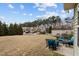 Scenic view of backyard, landscaping, outdoor seating area, and nearby homes at 241 Westgrove Ct, Durham, NC 27703