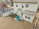 Aerial view of a quaint backyard featuring a patio seating area for relaxation at 241 Westgrove Ct, Durham, NC 27703