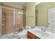 Bathroom with a glass enclosed shower, toilet and vanity with sink at 241 Westgrove Ct, Durham, NC 27703