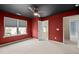 Bedroom with views, features modern ceiling fan, neutral carpet, and a connecting room at 241 Westgrove Ct, Durham, NC 27703