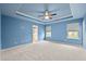 Large bedroom with tray ceiling and ensuite bathroom access at 241 Westgrove Ct, Durham, NC 27703