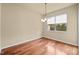Bright dining area with hardwood floors, chandelier and a large window at 241 Westgrove Ct, Durham, NC 27703
