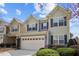 Charming two-story home with a two-car garage and manicured front yard landscaping at 241 Westgrove Ct, Durham, NC 27703