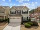 Charming two-story home with a two-car garage and manicured front yard landscaping at 241 Westgrove Ct, Durham, NC 27703
