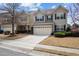 Charming two-story home with a well-kept lawn and an attached two-car garage at 241 Westgrove Ct, Durham, NC 27703