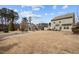 View of the property's well-maintained backyard and other houses in the neighborhood at 241 Westgrove Ct, Durham, NC 27703