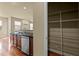 Kitchen adjacent to a pantry closet with wood floors and stainless steel appliances at 241 Westgrove Ct, Durham, NC 27703