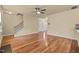 Spacious living room with hardwood floors and staircase to upper level at 241 Westgrove Ct, Durham, NC 27703