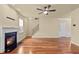 Cozy living room with hardwood floors, fireplace, and staircase at 241 Westgrove Ct, Durham, NC 27703