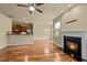 Open-concept layout with a modern fireplace and adjacent kitchen area at 241 Westgrove Ct, Durham, NC 27703