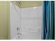 Clean white shower with tile and shower head at 241 Westgrove Ct, Durham, NC 27703