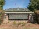 Inviting entrance to Chapel Ridge Golf Club with stone accents and manicured landscaping at 249 High Ridge Ln, Pittsboro, NC 27312