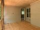 Covered porch with wood flooring and painted walls and trim shows an entry to the home's interior at 249 High Ridge Ln, Pittsboro, NC 27312