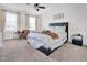 Bright bedroom with many windows, a ceiling fan, and a comfortable seating area at 2741 Rains Dr, Haw River, NC 27258