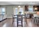 Open concept living space includes a dining area with a table and chairs adjacent to the kitchen at 2741 Rains Dr, Haw River, NC 27258