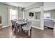 Open dining area with hardwood floors flows seamlessly into the adjacent living room at 2741 Rains Dr, Haw River, NC 27258