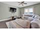Cozy living room featuring a comfortable sectional sofa, TV, and plenty of natural light at 2741 Rains Dr, Haw River, NC 27258