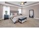 Spacious main bedroom with a tray ceiling, plush carpet, and an upholstered bed frame at 2741 Rains Dr, Haw River, NC 27258