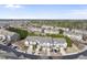 Aerial view of townhome community surrounded by lush trees and well-maintained streets at 2821 Casona Way, Raleigh, NC 27616